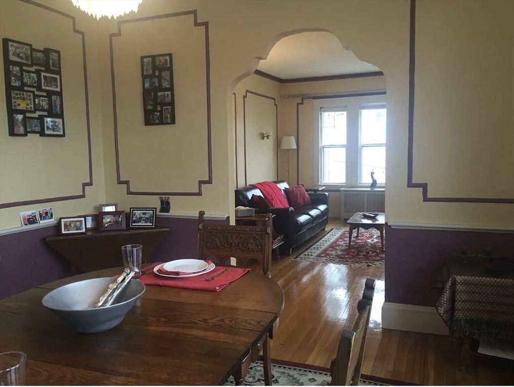 30 Lawrence Street, Unit 2 Everett, MA 02149 - Photo 3 of 13 a living room with furniture and a potted plant