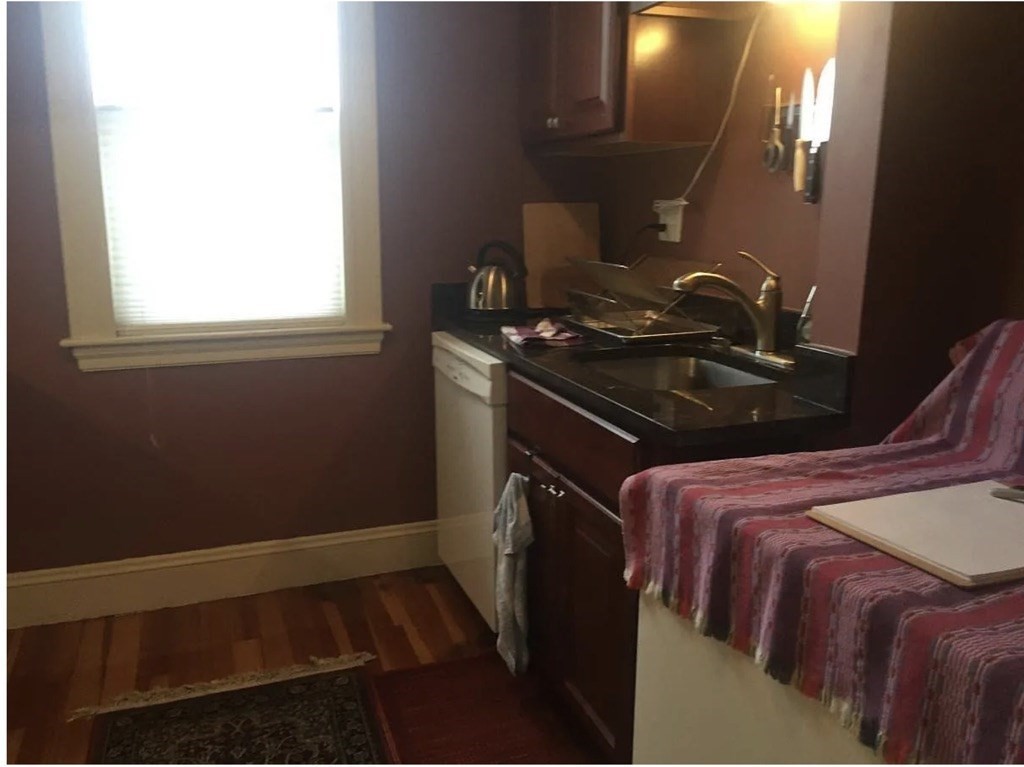 30 Lawrence Street, Unit 2 Everett, MA 02149 - Photo 5 of 13 a bedroom with a bed and a window
