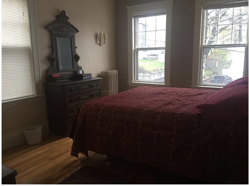 30 Lawrence Street, Unit 2 Everett, MA 02149 - Photo 7 of 13 a bedroom with a bed and a window