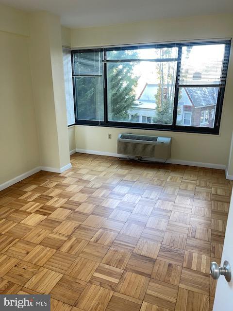 3601 Wisconsin Avenue Northwest, Unit 309 Washington, DC 20016 - Photo 8 of 14 a view of wooden floor with a large window