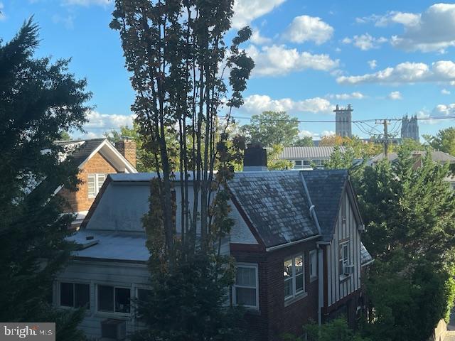 3601 Wisconsin Avenue Northwest, Unit 309 Washington, DC 20016 - Photo 10 of 14 a view of a wooden house with a yard