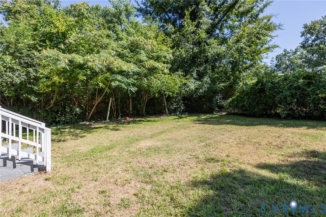 3505 Meadowbridge Road Richmond, VA 23222 - Photo 19 of 20 Expansive backyard with mature tree-lined perimete
