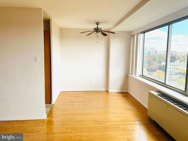 a view of a room with a large window
