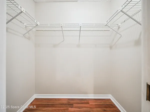 a spacious bathroom with a double vanity sink a mirror and a shower