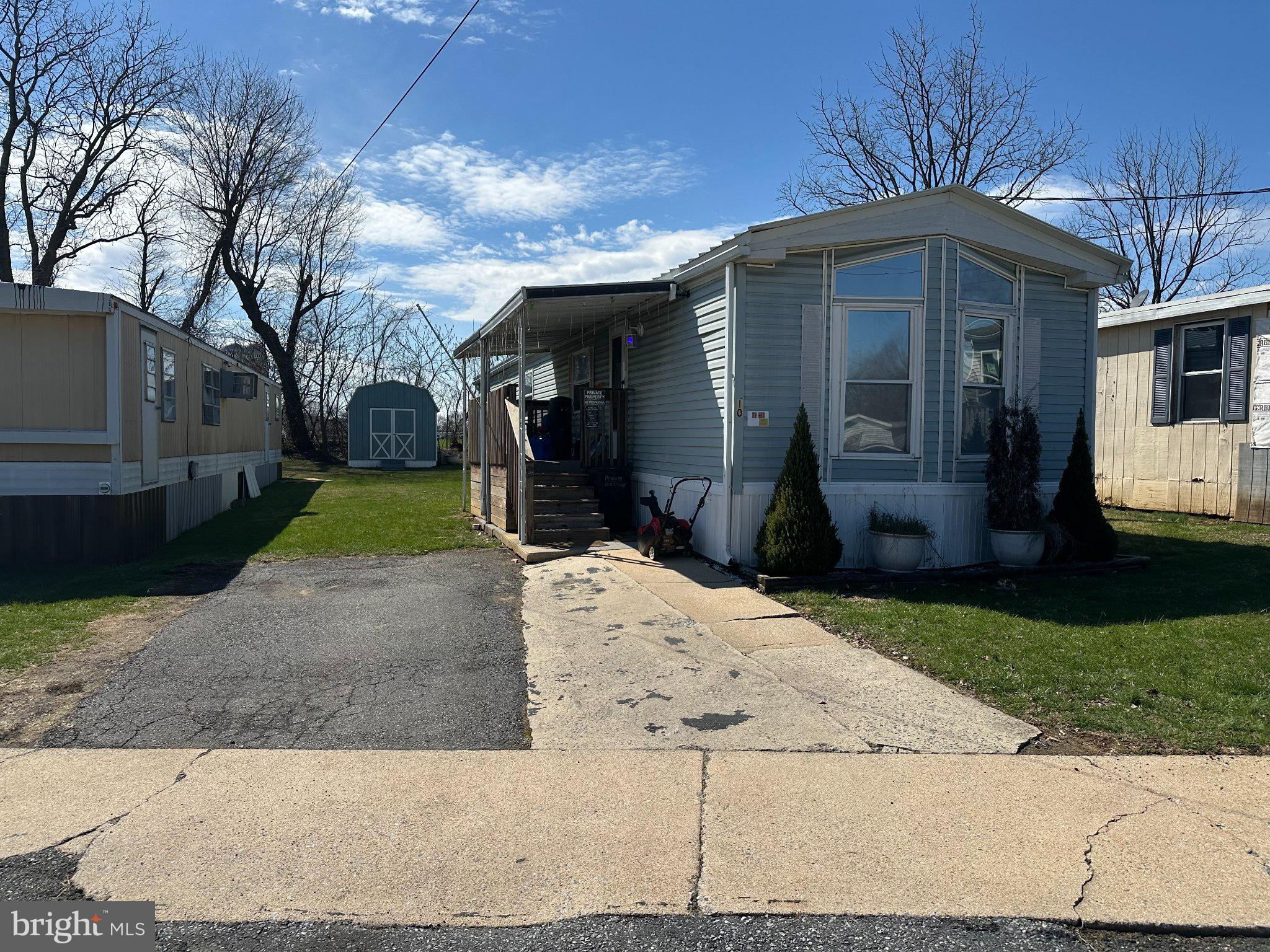 10 Roth Avenue Mertztown, PA 19539 - Photo 2 of 21 a front view of a house with a yard and garden