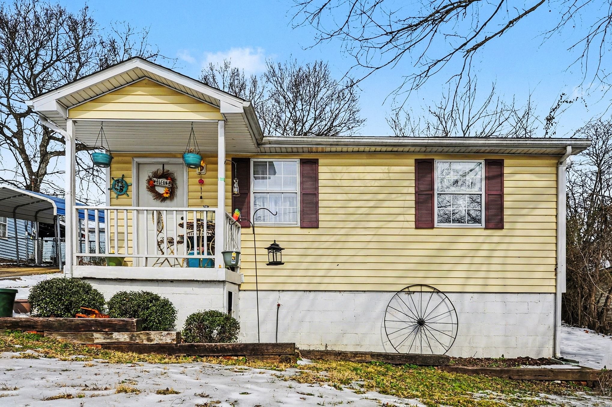 a front view of a house with garden