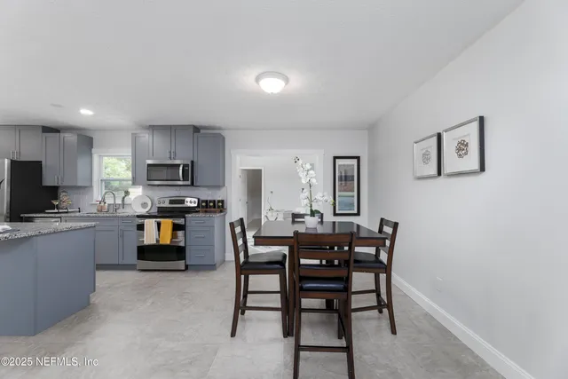 a view of kitchen with sink and microwave
