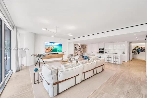 a view of living room with furniture and flat screen tv