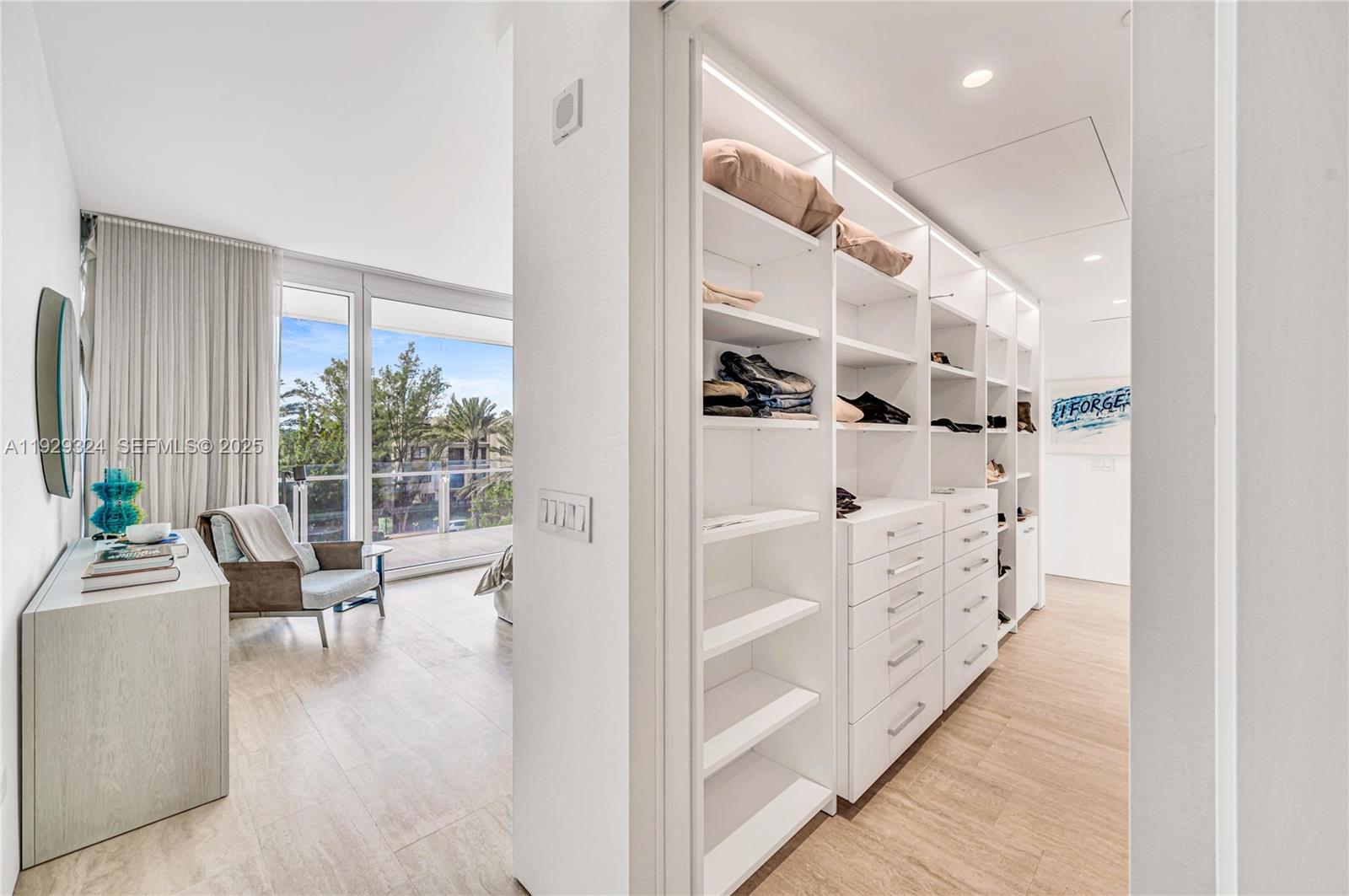 9111 Collins Avenue, Unit N322 Surfside, FL 33154 - Photo 7 of 23 a view of livingroom with furniture and rug floor