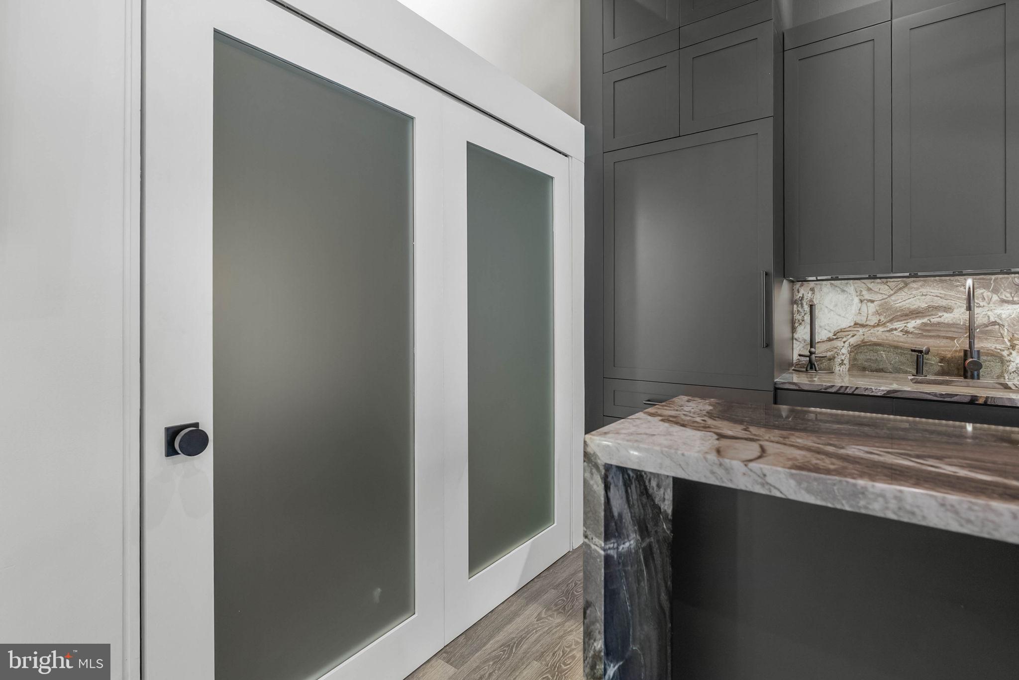 219 South 18th Street, Unit 710 Philadelphia, PA 19103 - Photo 17 of 51 a bathroom with a granite countertop sink and a mirror