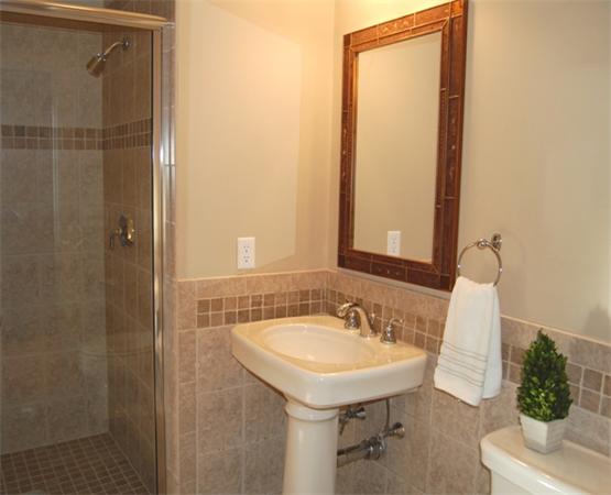 22 Martingale Road Lexington, MA 02421 - Photo 11 of 26 a bathroom with a sink and a mirror