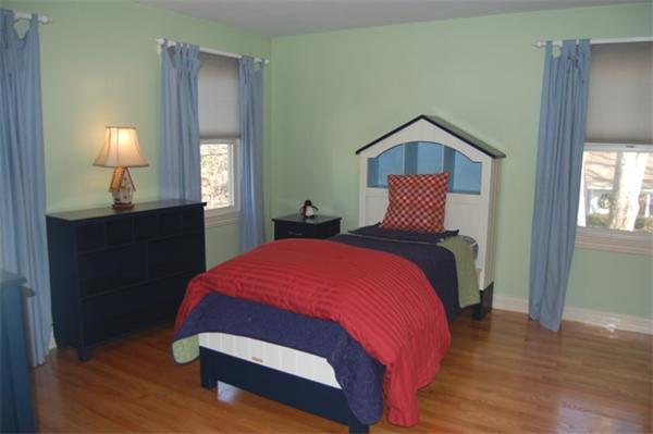 22 Martingale Road Lexington, MA 02421 - Photo 17 of 26 a bedroom with a bed and a lamp