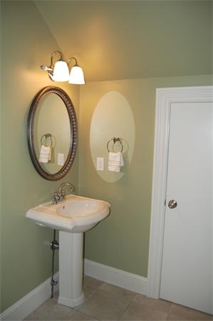 22 Martingale Road Lexington, MA 02421 - Photo 25 of 26 a bathroom with a sink and a mirror