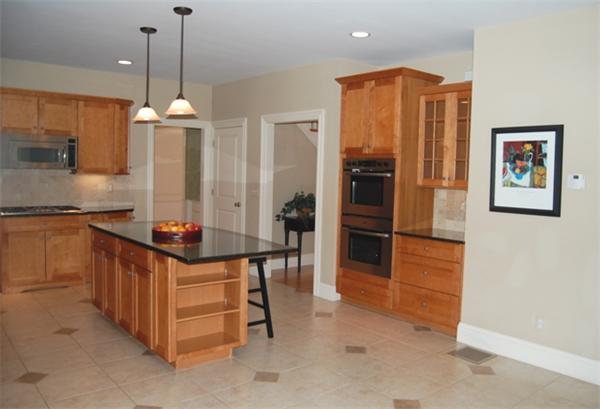 22 Martingale Road Lexington, MA 02421 - Photo 9 of 26 a kitchen with stainless steel appliances granite countertop a stove and a refrigerator