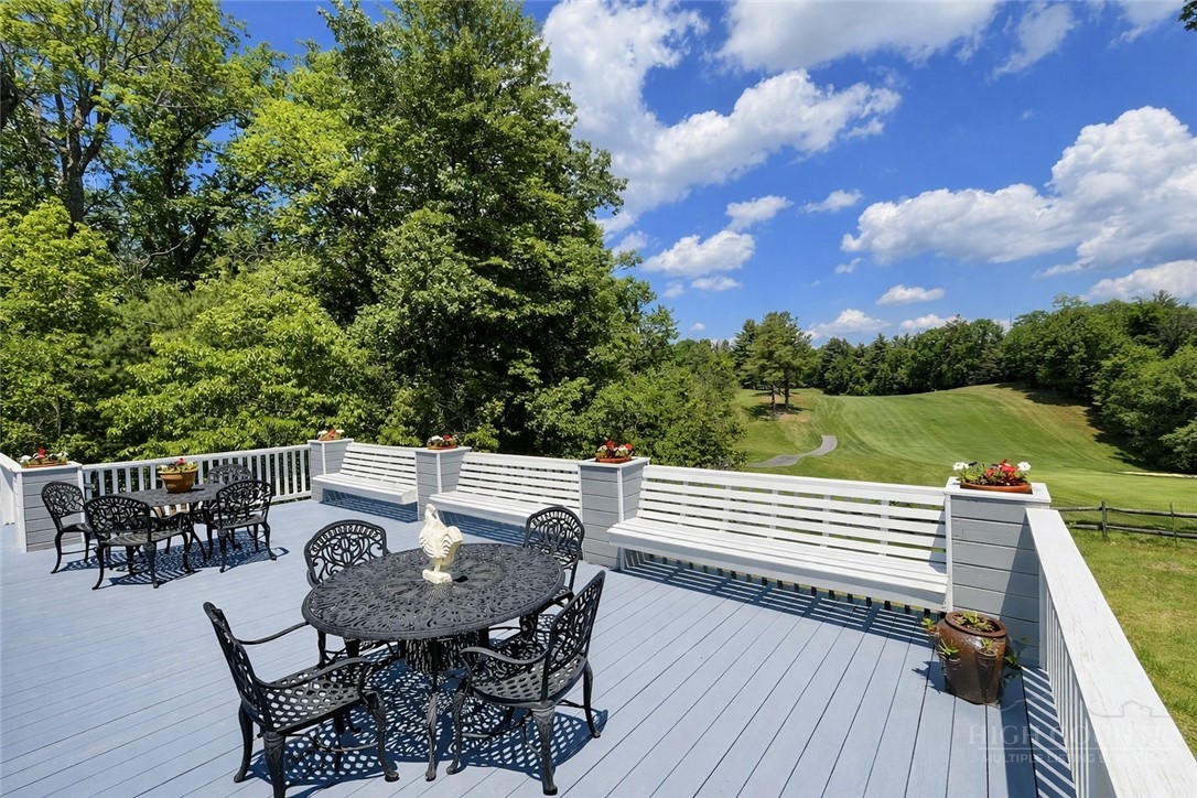 638 Ridge Road Glade Valley, NC 28627 - Photo 39 of 44 a view of a patio with a table