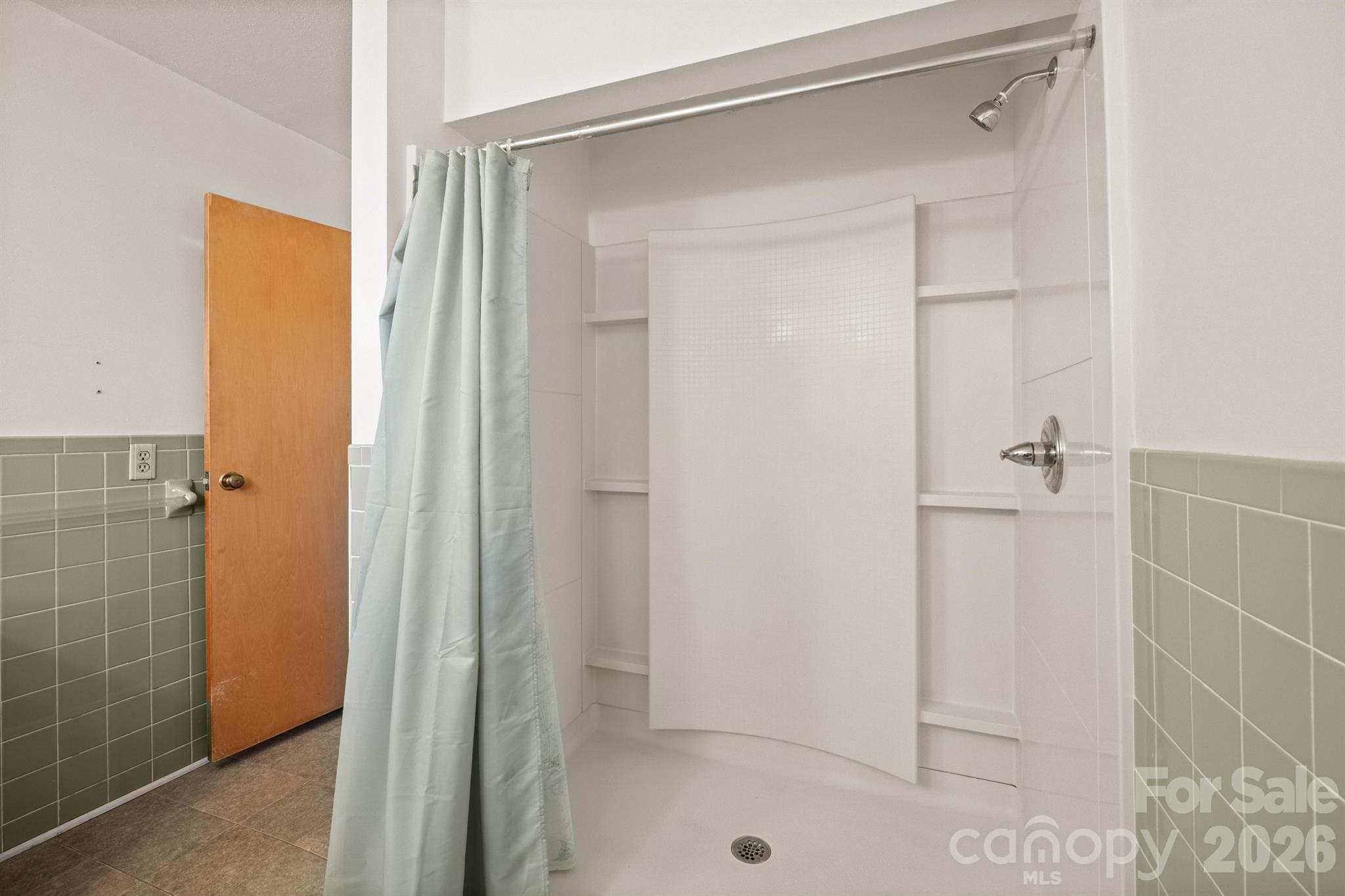 482 Miller Farm Road Statesville, NC 28625 - Photo 19 of 46 a bathroom with a glass shower door