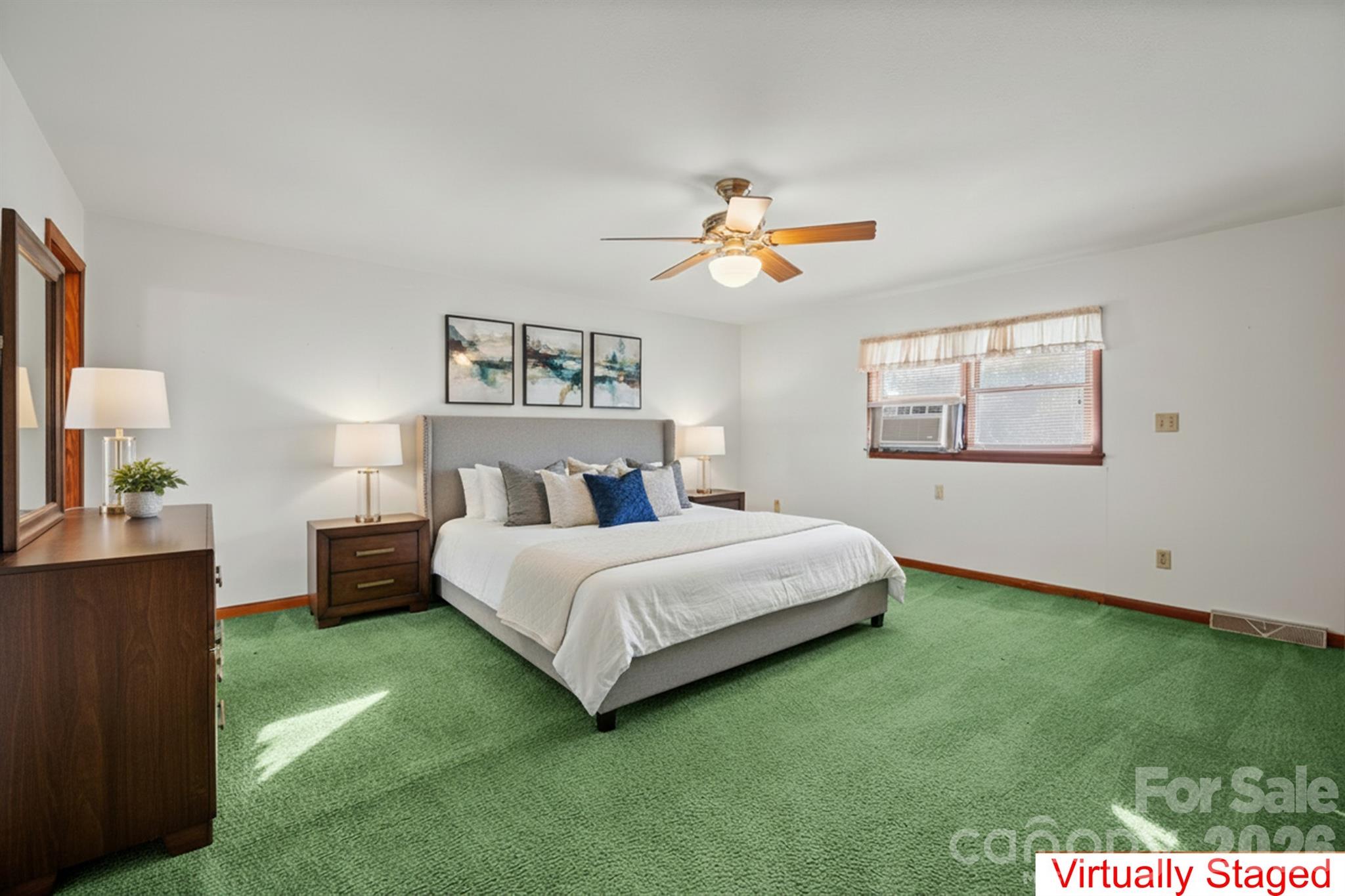 482 Miller Farm Road Statesville, NC 28625 - Photo 21 of 46 a bedroom with a bed and a painting on the wall