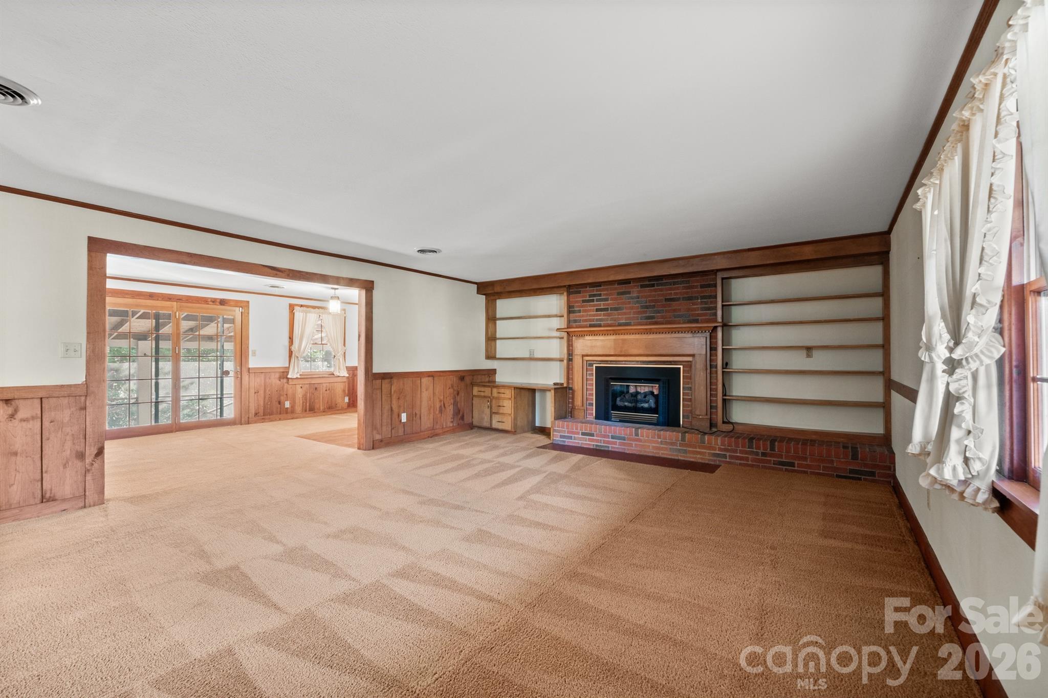 482 Miller Farm Road Statesville, NC 28625 - Photo 35 of 46 a view of an empty room with a fireplace and a window