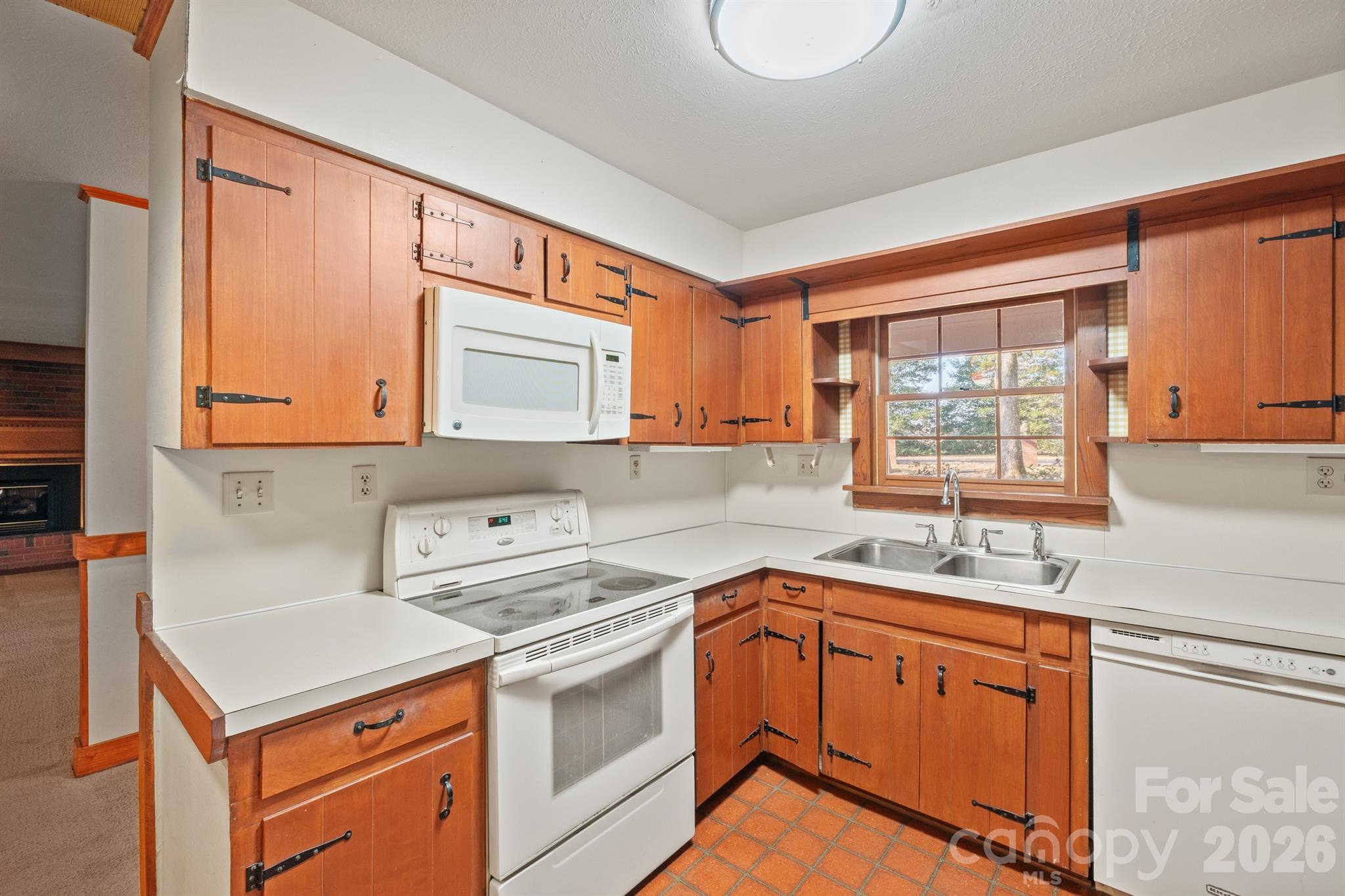 482 Miller Farm Road Statesville, NC 28625 - Photo 42 of 46 a kitchen with stainless steel appliances a sink a stove and a microwave