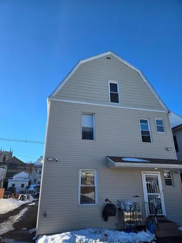 a front view of a house with parking space