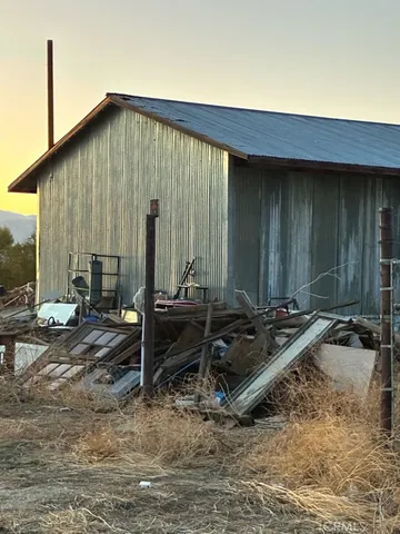 a backyard of a house with outdoor seating