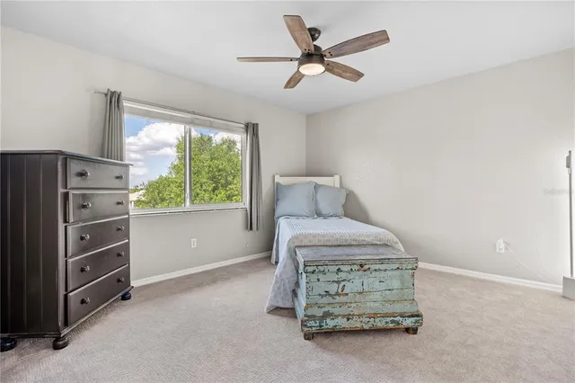 a view of dining room and livingroom with furniture wooden floor a flat screen tv
