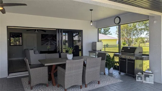 a view of a chair and table in the garden