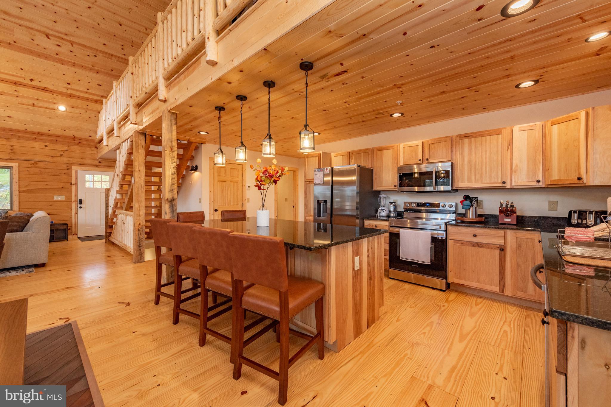 37 Ridgeline Trail McHenry, MD 21541 - Photo 12 of 59 a kitchen with stainless steel appliances a refrigerator and wooden cabinets