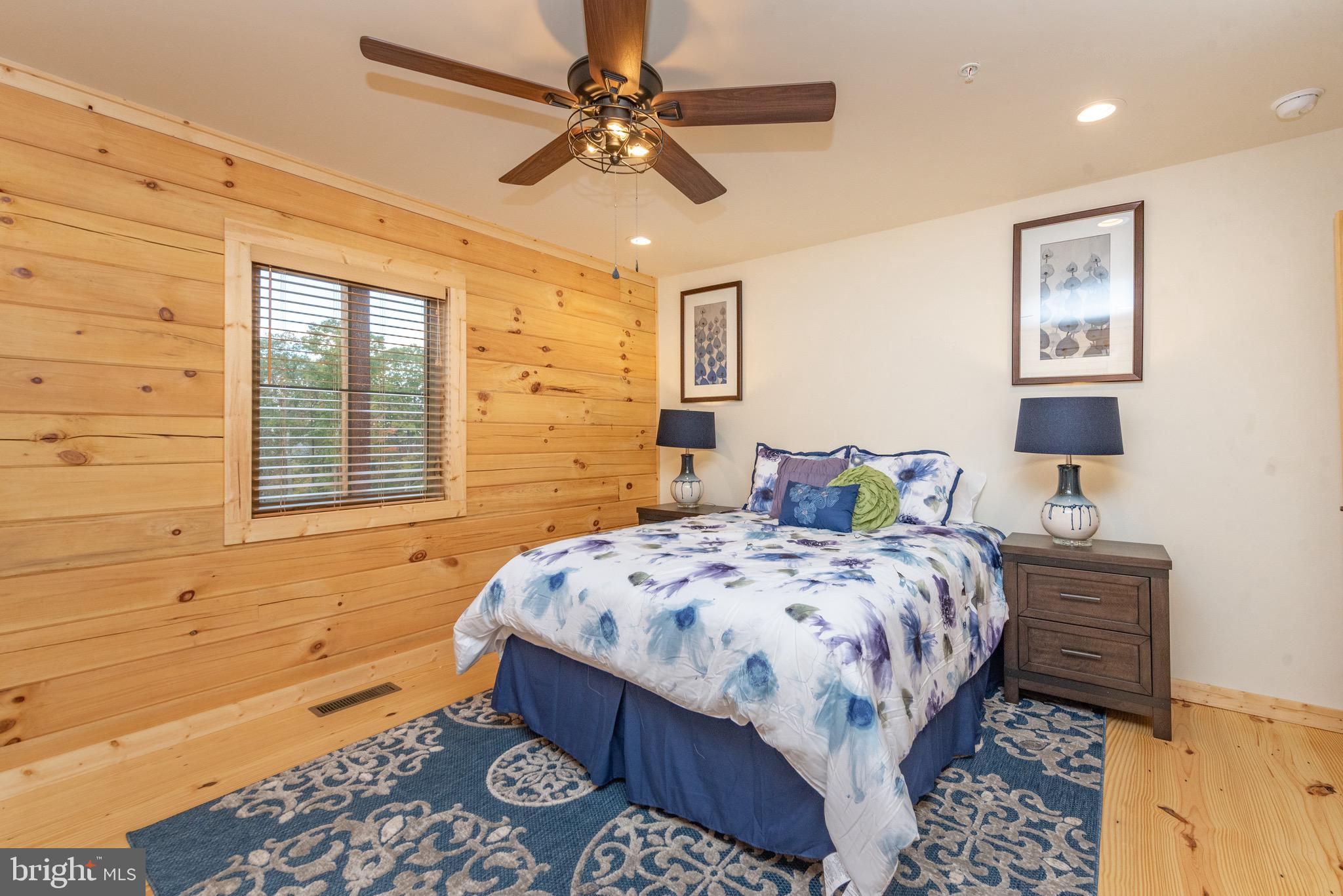 37 Ridgeline Trail McHenry, MD 21541 - Photo 27 of 59 a bedroom with a bed and a chandelier