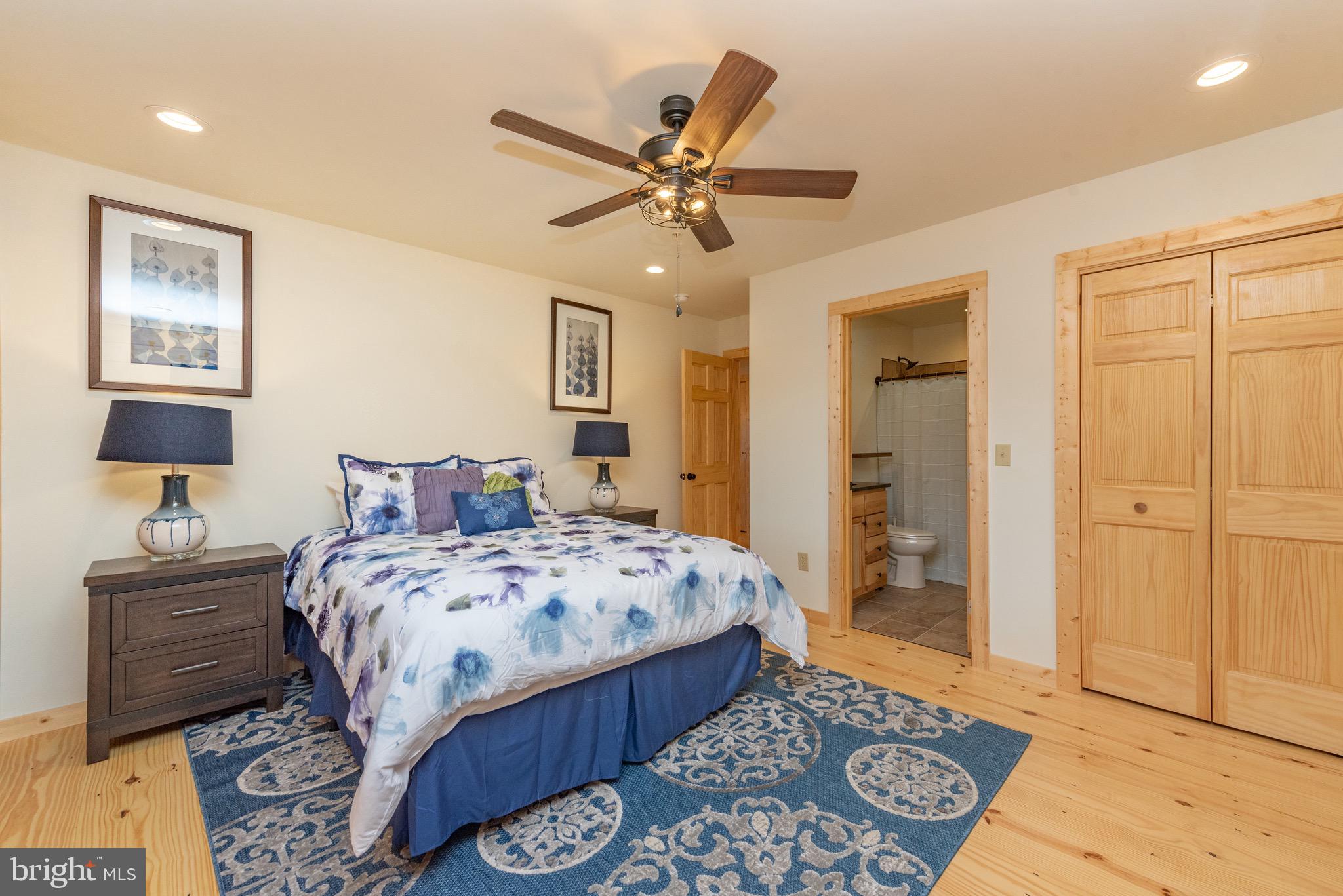 37 Ridgeline Trail McHenry, MD 21541 - Photo 28 of 59 a bedroom with a bed and a lamp on dresser