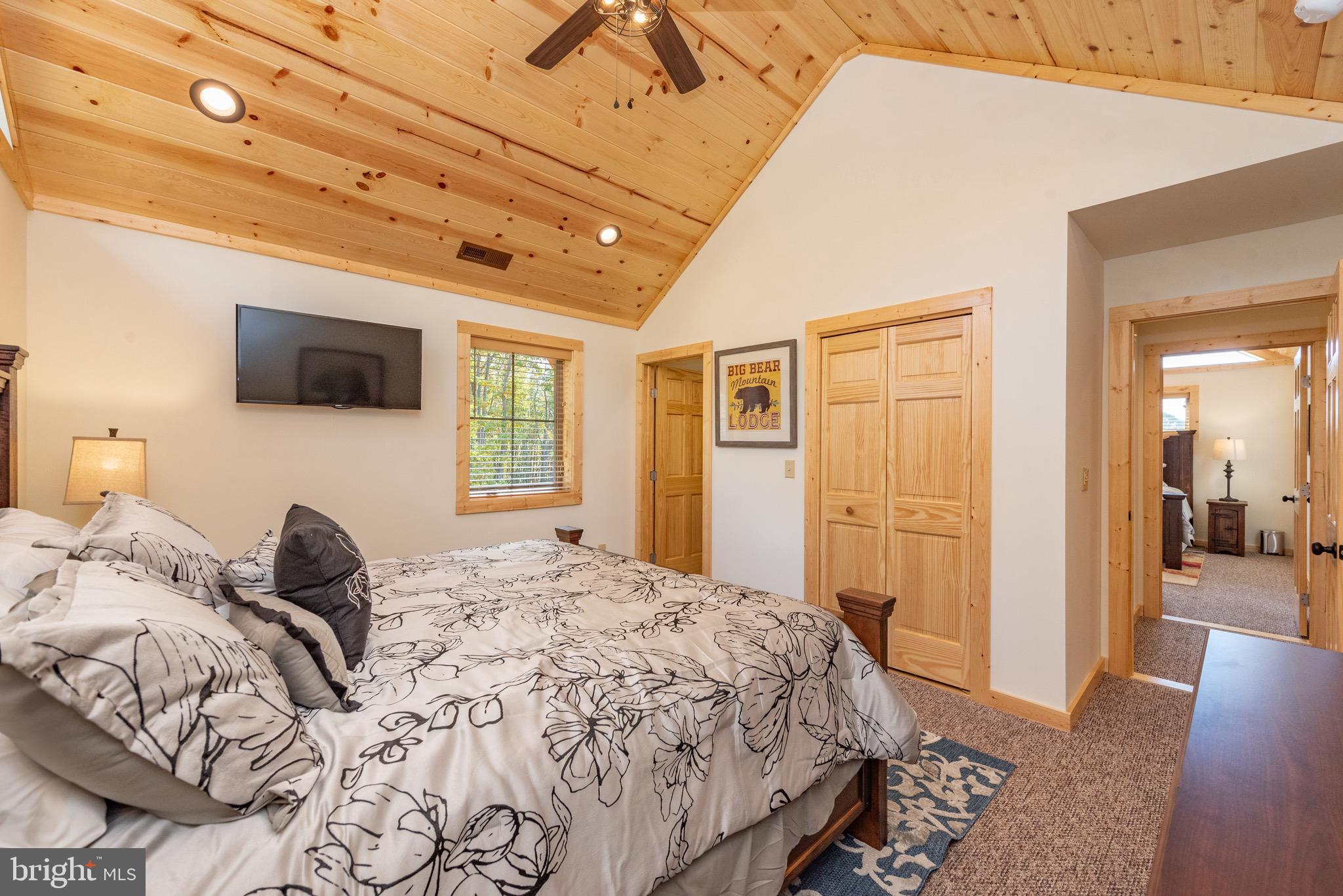 37 Ridgeline Trail McHenry, MD 21541 - Photo 38 of 59 a bedroom with a bed and a flat tv screen