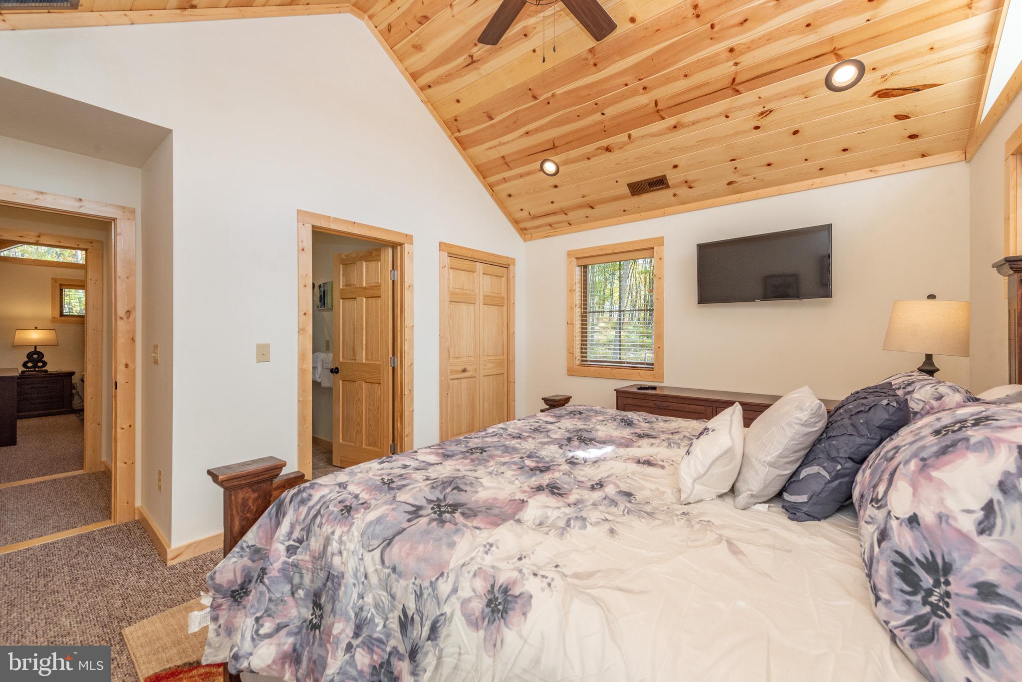 37 Ridgeline Trail McHenry, MD 21541 - Photo 40 of 59 a bedroom with a bed and a flat screen tv