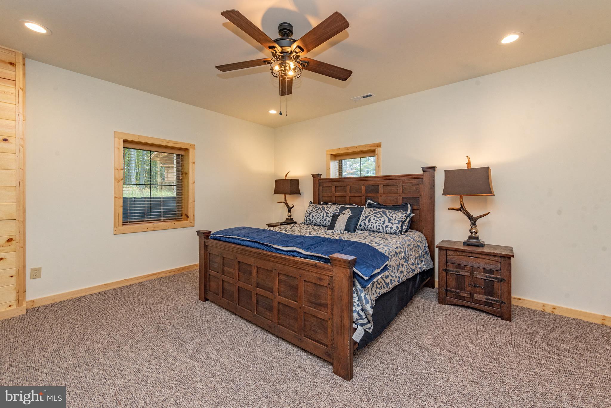 37 Ridgeline Trail McHenry, MD 21541 - Photo 50 of 59 a bed room with a bed and a ceiling fan