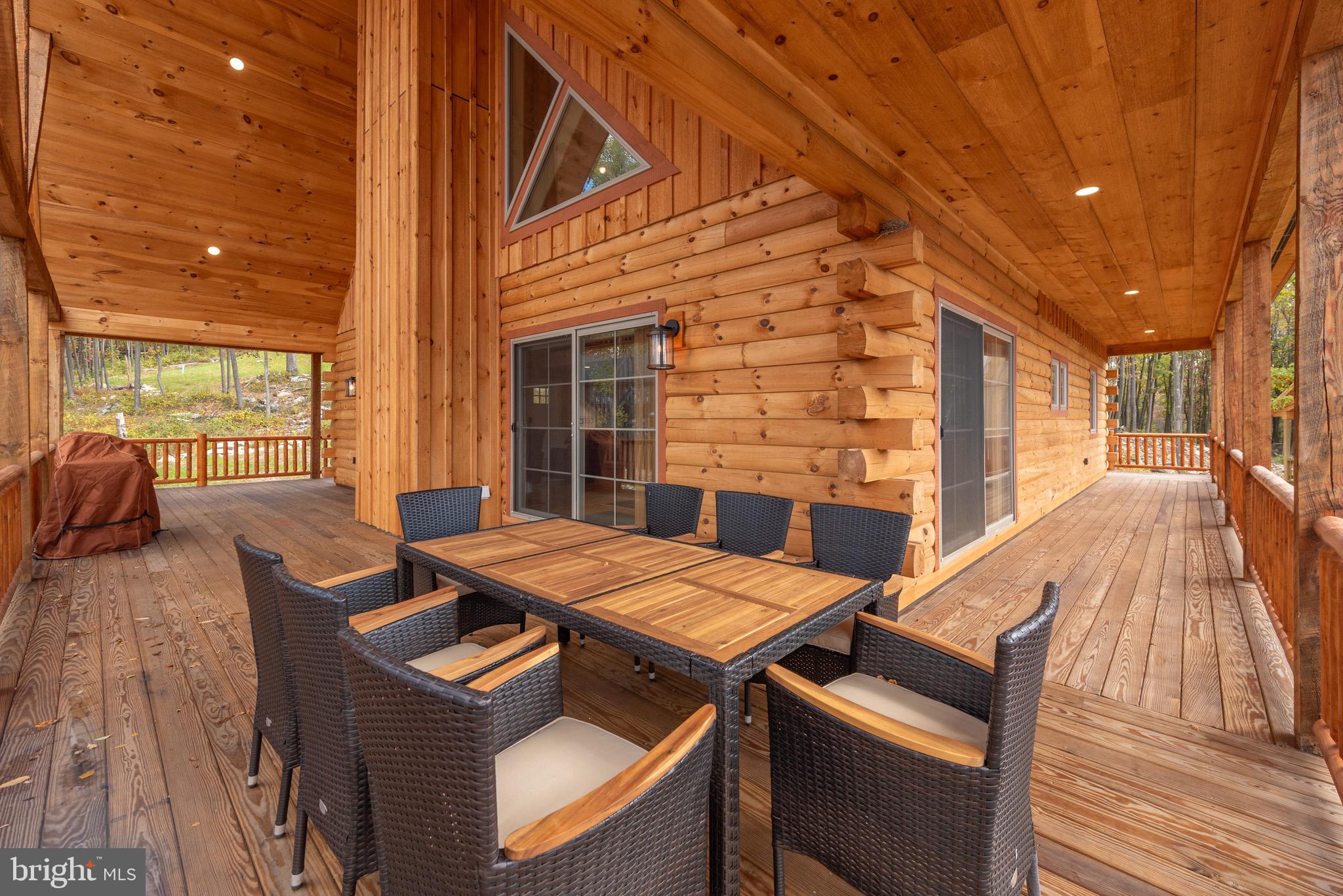 37 Ridgeline Trail McHenry, MD 21541 - Photo 5 of 59 a view of a patio with a table and chairs