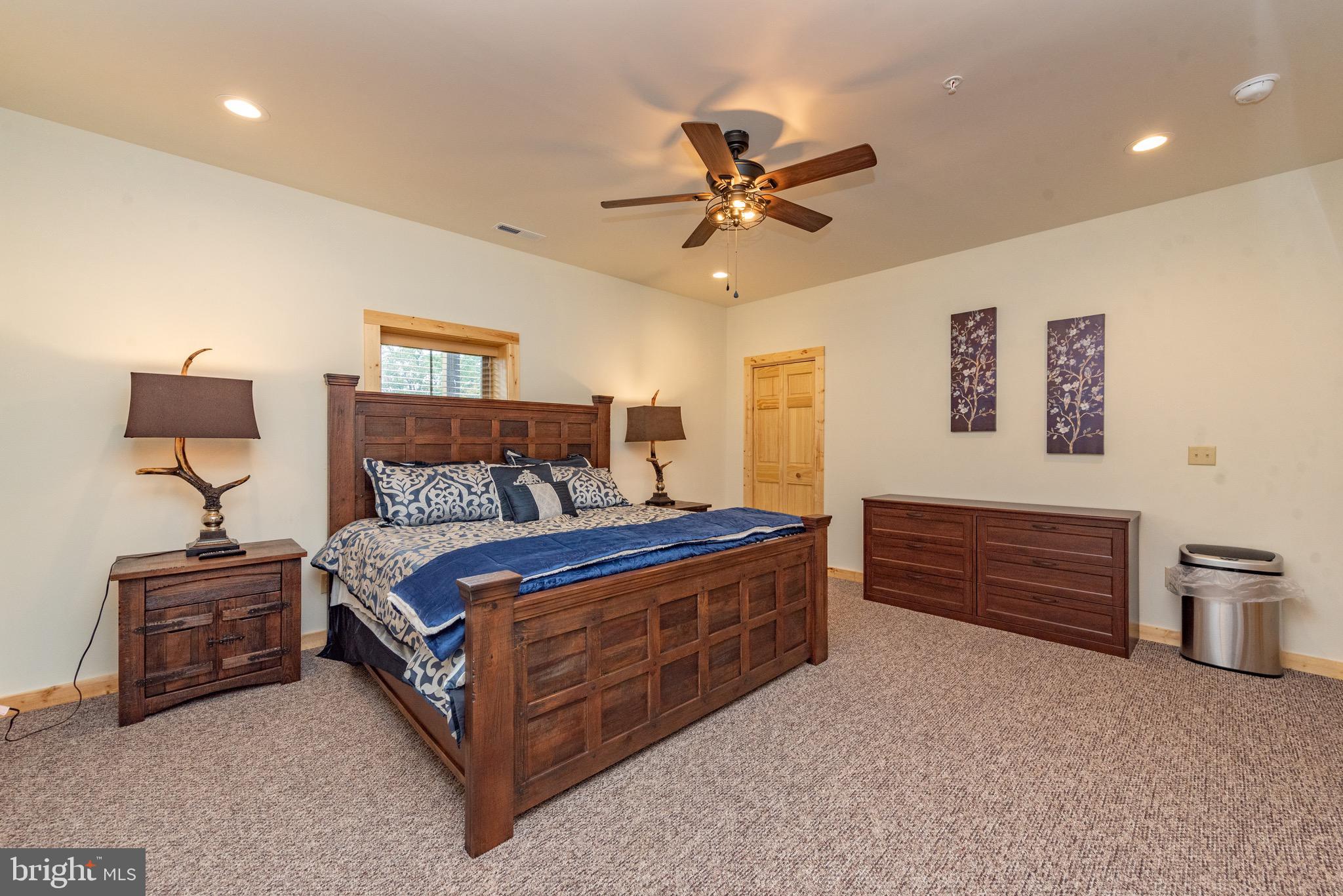 37 Ridgeline Trail McHenry, MD 21541 - Photo 51 of 59 a bed room with a bed and a lamp