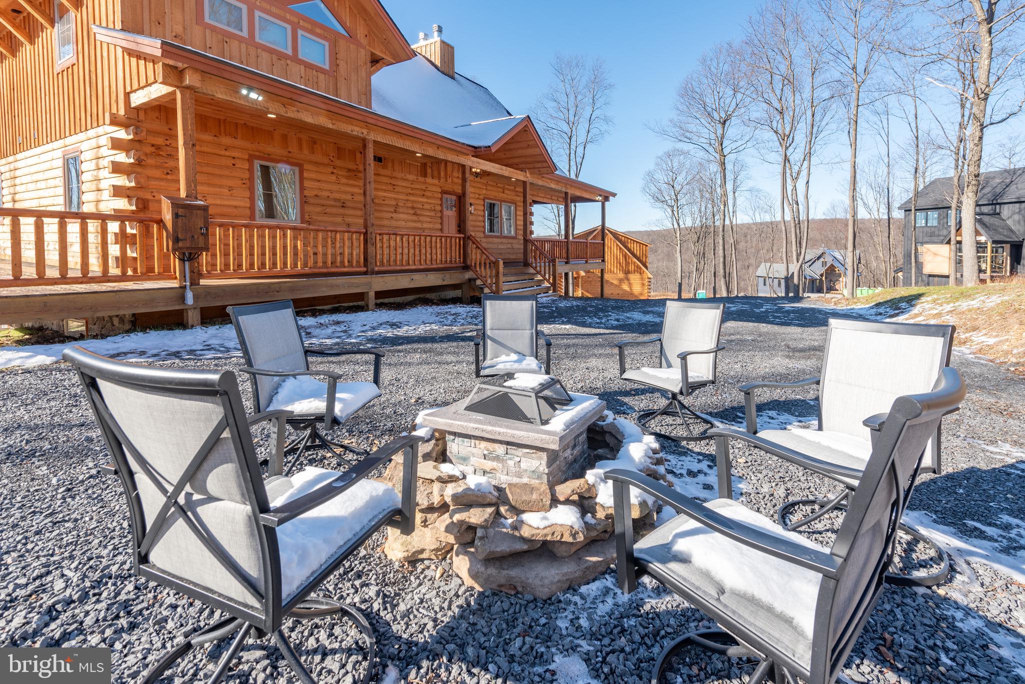 37 Ridgeline Trail McHenry, MD 21541 - Photo 55 of 59 a view of a chairs and table in the back yard of the house