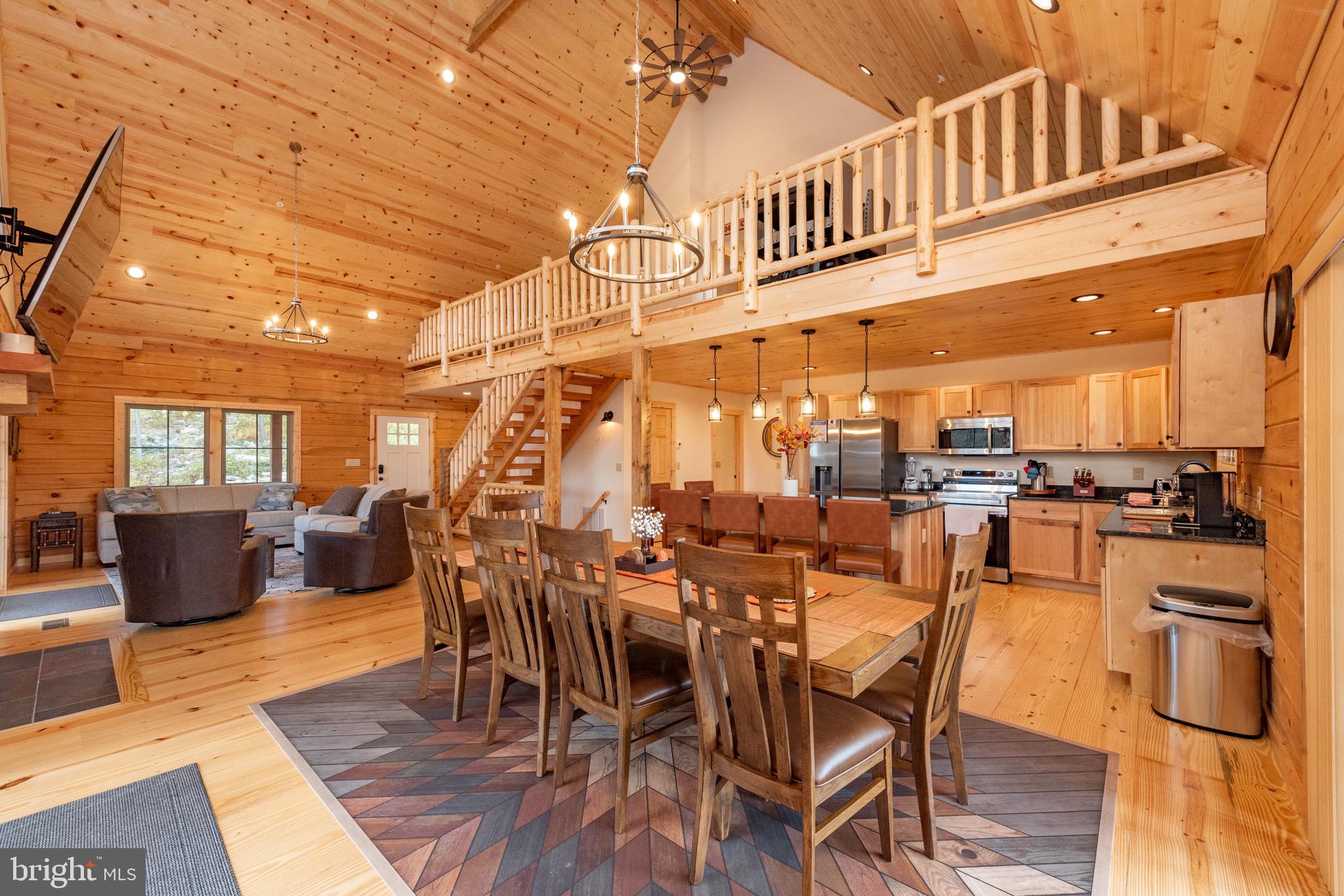 37 Ridgeline Trail McHenry, MD 21541 - Photo 10 of 59 a view of a dining hall with furniture and wooden floor