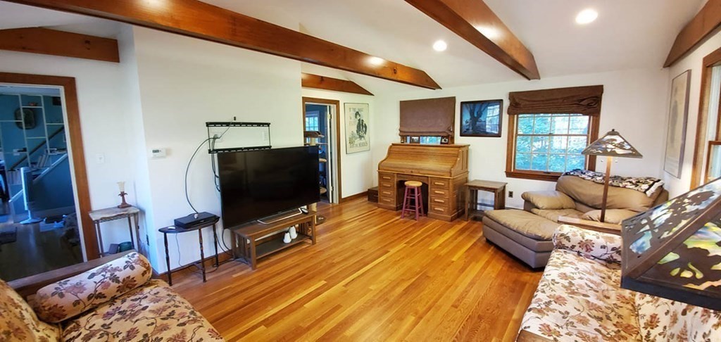 250 Concord Road Wayland, MA 01778 - Photo 6 of 16 a living room with furniture and a flat screen tv