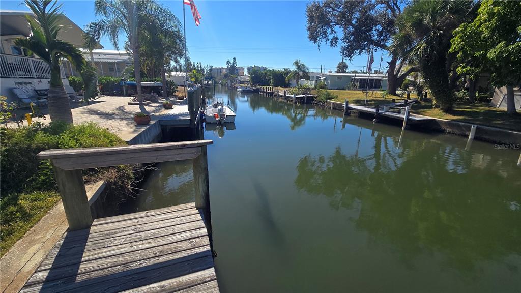 43 Hatchett Creek Road Venice, FL 34285 - Photo 6 of 6 a view of swimming pool with outdoor seating and lake view