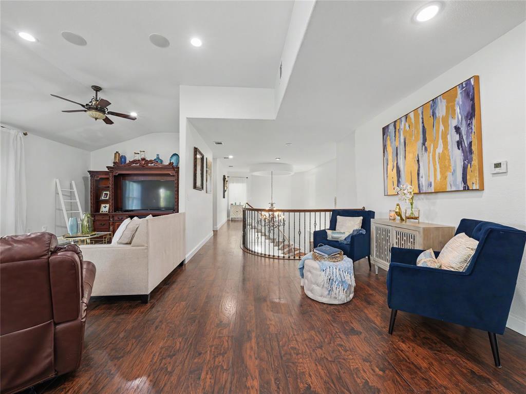 6701 Nauert Road Forest Hill, TX 76140 - Photo 30 of 40 Spacious interior featuring rich wood-finish flooring, recessed lighting, a ceiling fan, and an open-concept design with a curved staircase railing