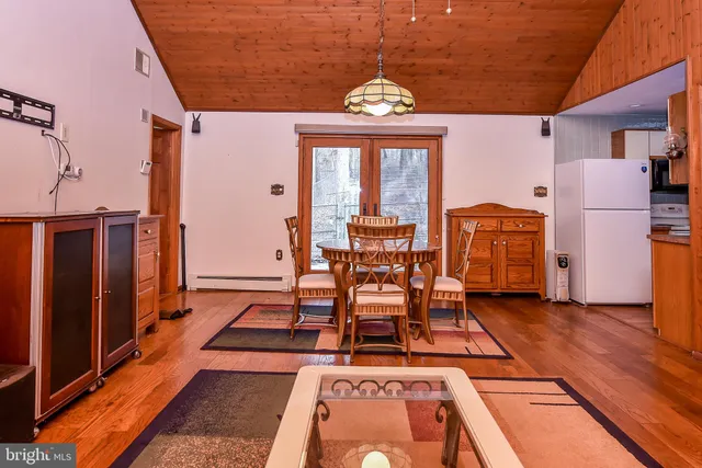 a kitchen with stainless steel appliances granite countertop a sink a stove and cabinets