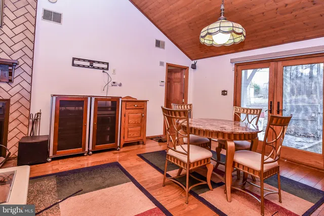 a kitchen with a refrigerator sink and a stove