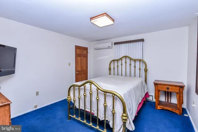 a kitchen with a refrigerator a sink dishwasher a stove and white cabinets with wooden floor