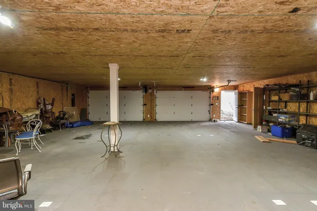 a view of a basketball area with large trees