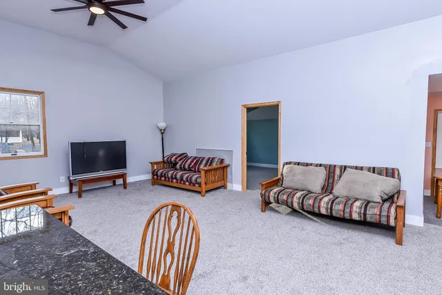 a house that has a tree in front of the house