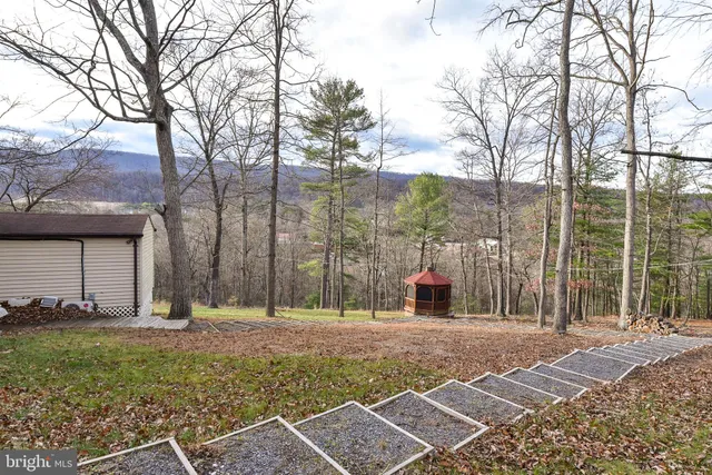 a backyard of a house with lots of green space