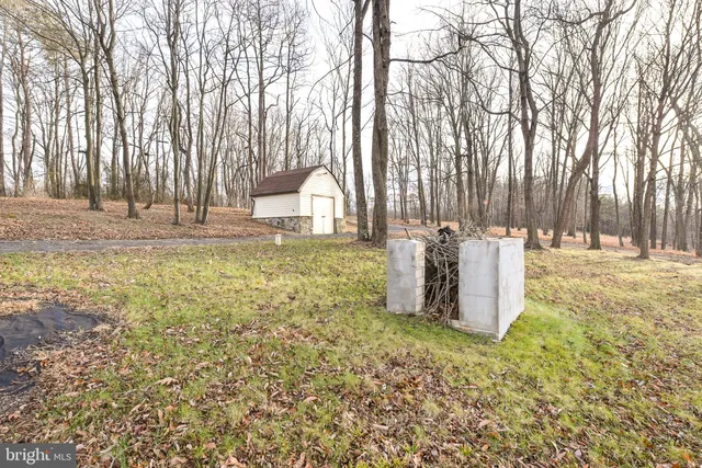 a view of a dining room with furniture wooden floor and chandelier