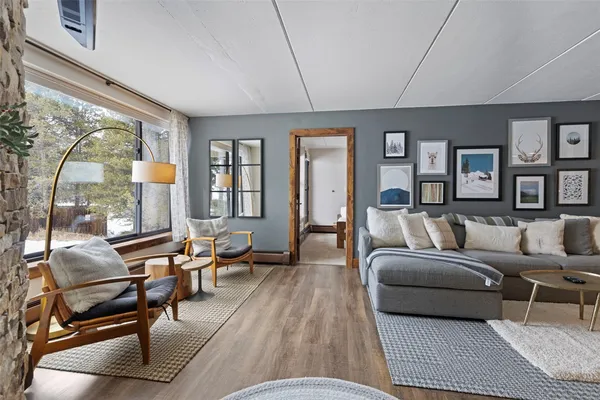 a living room with furniture and a window