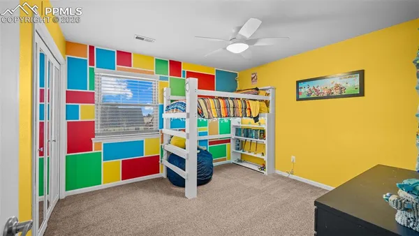 a view of game room with window and projector