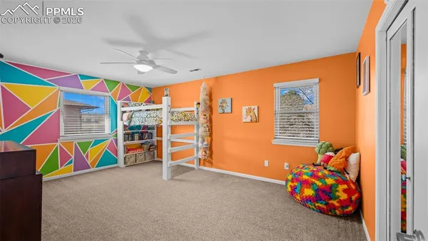 a view of play room with windows